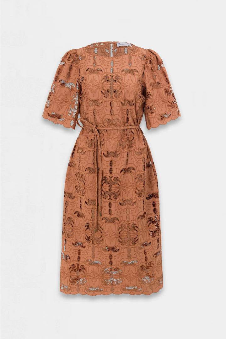 A terracotta orange midi dress with a textured, patterned jacquard weave, featuring short puff sleeves, a self-tie waist belt, and a scalloped hem, shown against a light gray background.