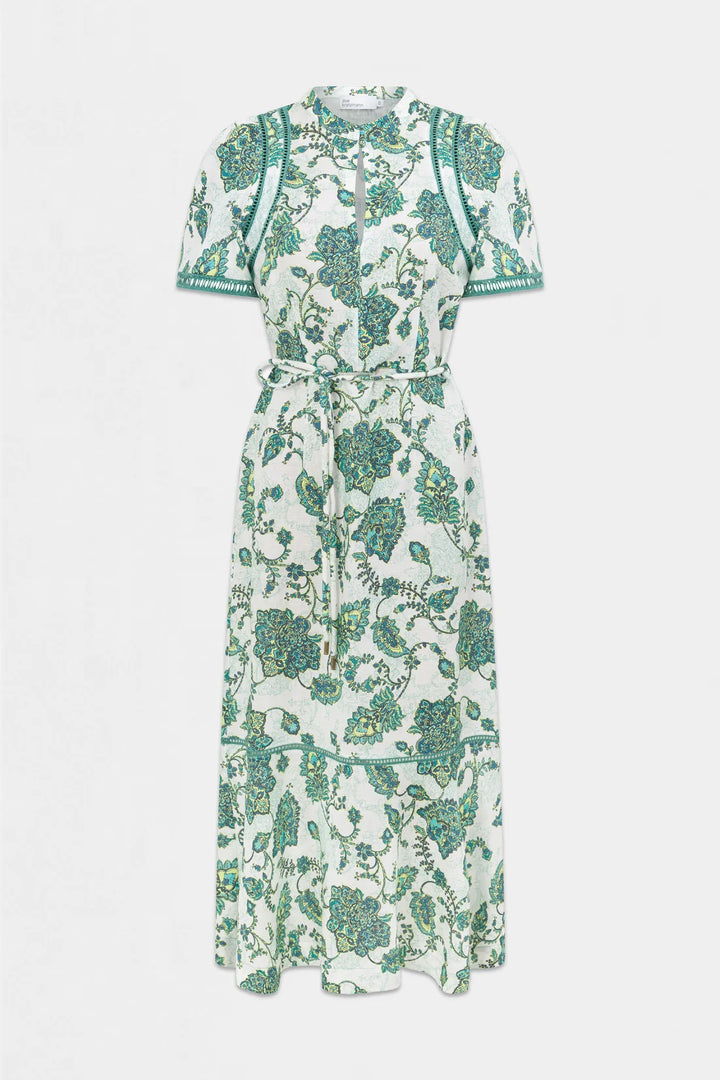 A short-sleeve midi dress with a green and teal floral and botanical print on a white background, featuring a tie waist and embroidered detailing on the shoulders and sleeves, shown against a light gray background.