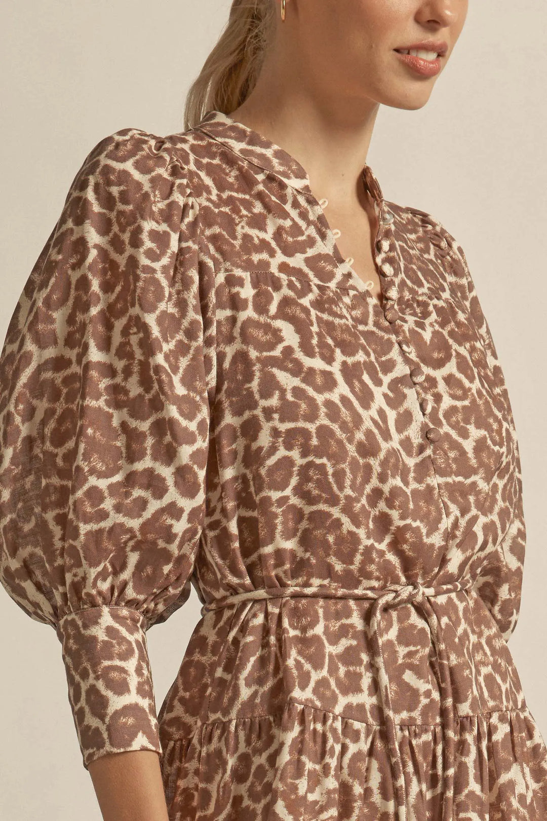 Leopard print dress worn by a person on a neutral background